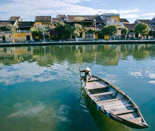 person rowing in river