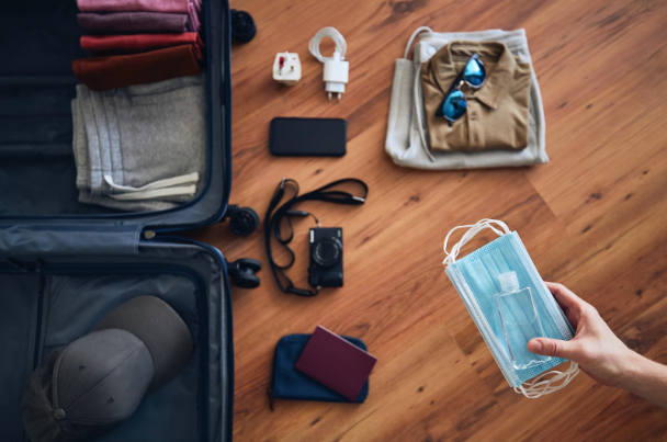 top view of a person packing a luggage