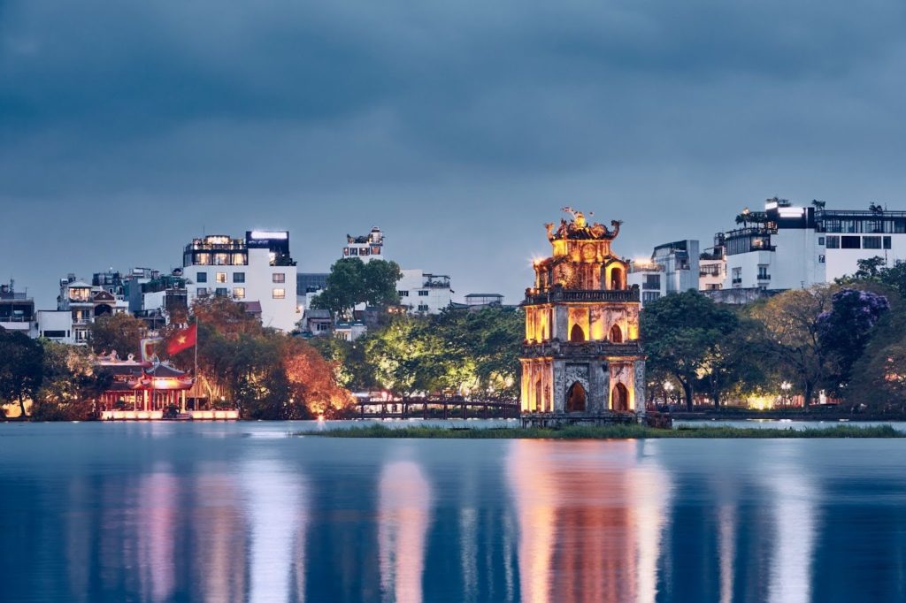 A wide shot of Hoan Kiem Lake in Hanoi, Vietnam